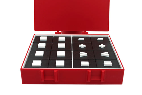 Red box with black interior holding white and black geometric blocks on a white background